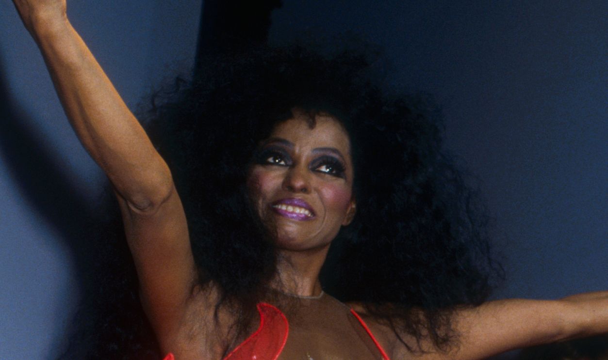 German designer Thierry Mugler shows his women's 1991 spring-summer ready-to-wear line in Paris. Singer Diana Ross is modeling a sequined bodysuit with an elaborate red train