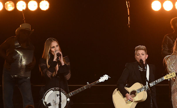 Beyonce (R) performs onstage with Emily Robison and Natalie Maines of Dixie Chicks
