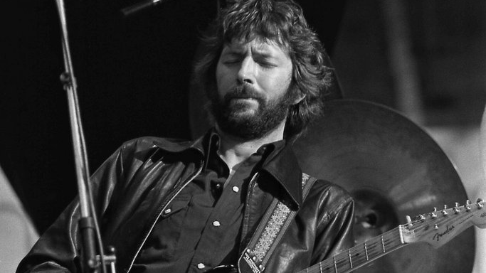 Grayscale Portrait Photo of Eric Clapton performing in Rotterdam