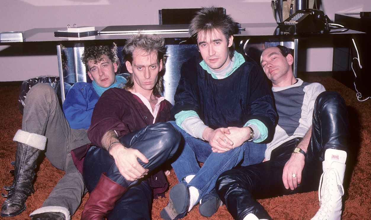 New Wave music group Re-Flex meets with their record label