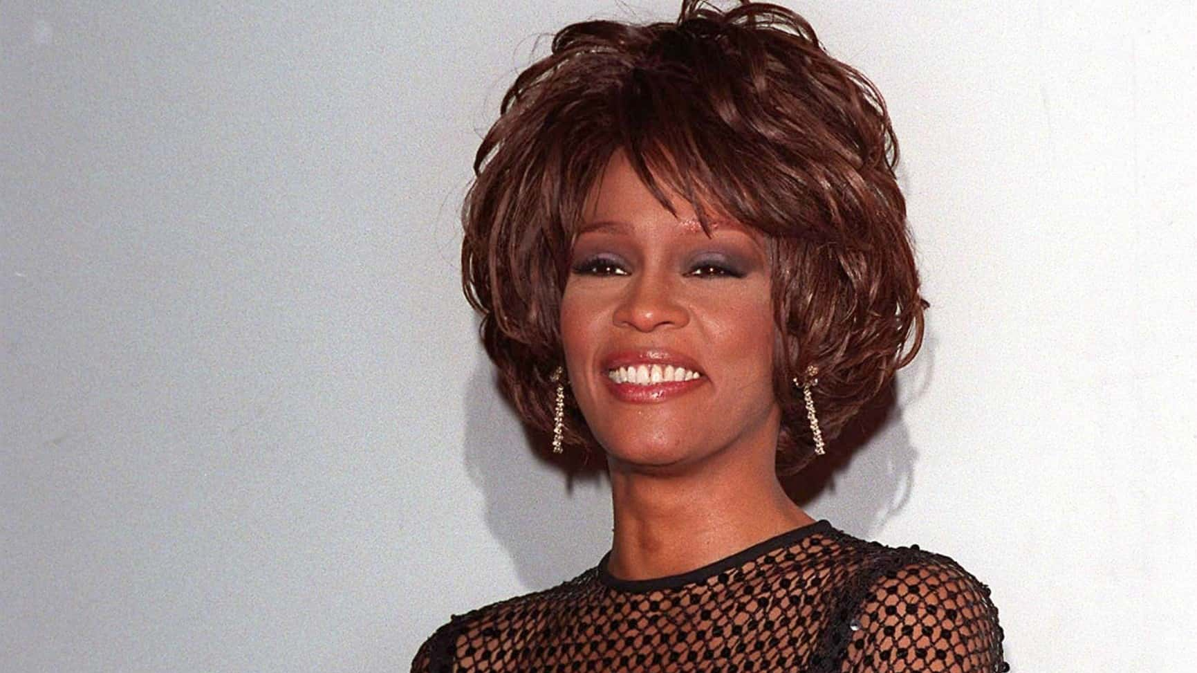 Whitney Houston at the Soul Train Awards in black transparent shirt - 1998