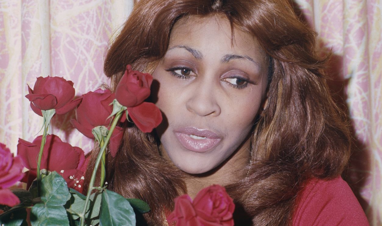Tina Turner Holding Red Roses