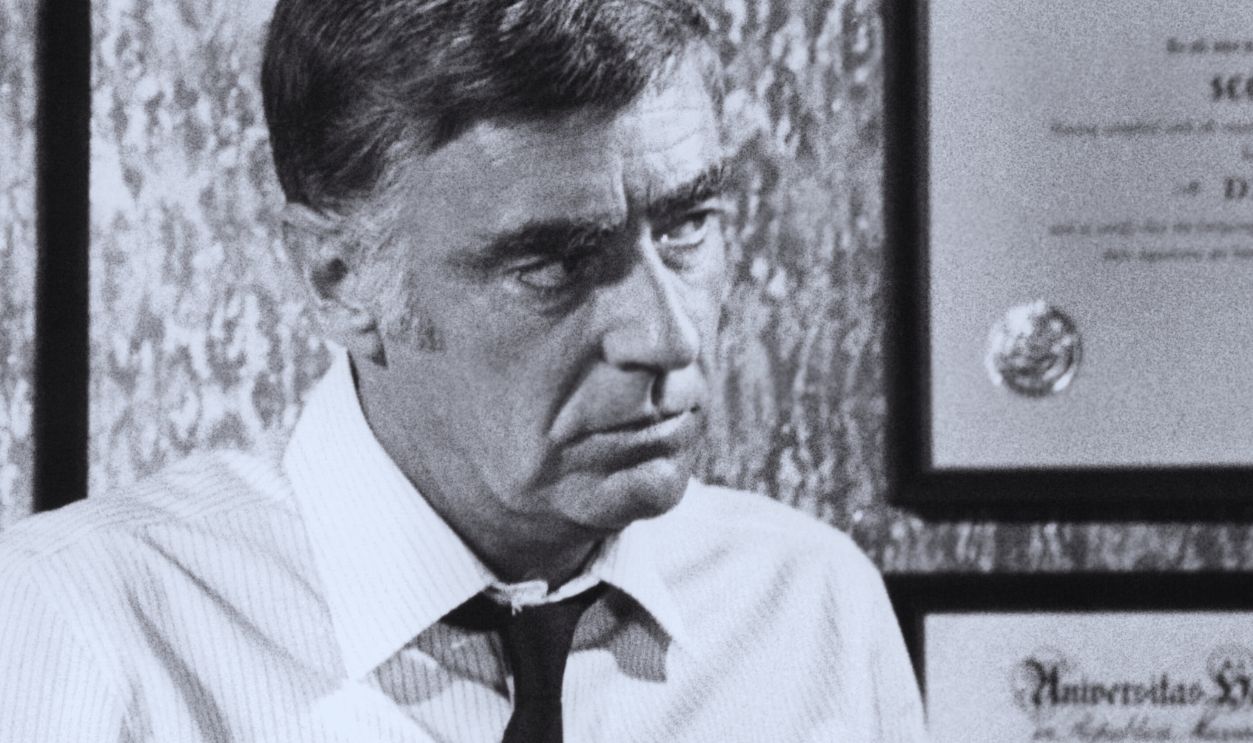 Jerry Lewis speaks to Peter Lawford in his office in a scene from the film 'Hook, Line and Sinker', 1969. 