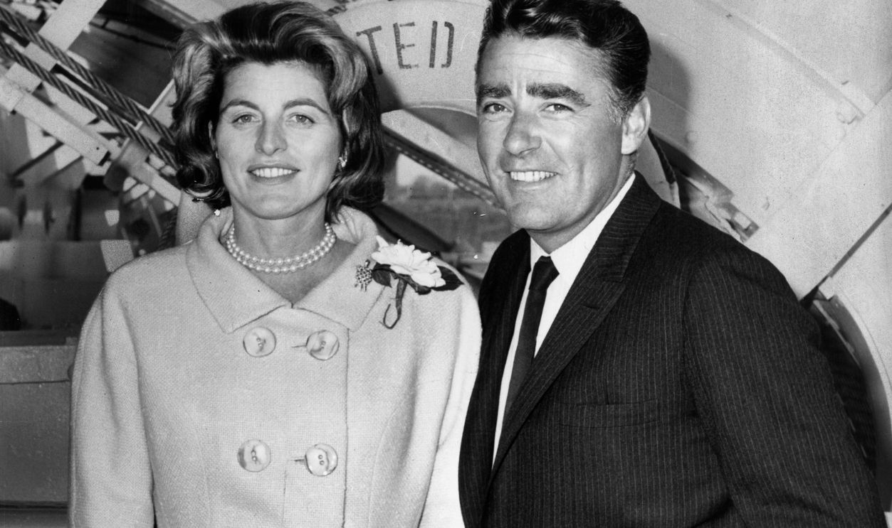 circa 1965: Patricia Kennedy (1924 - 2006) (sister of US president John F. Kennedy) and her husband, British actor Peter Lawford (1923 - 1984), pose together on the gangplank of a ship.