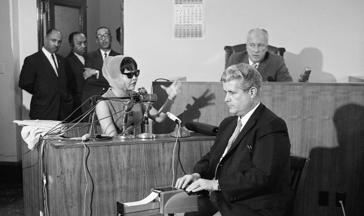 Witness Elisa Boyer, wearing a disguise, testifies during the Coroner's Inquest of the murder of soul singer Sam Cooke.