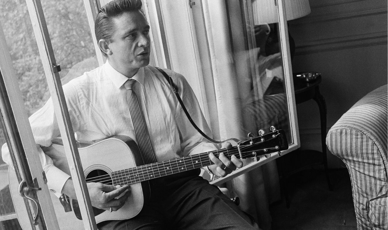 American country singer and musician Johnny Cash poses for photographers at the Savoy Hotel in London. 17th September 1959.