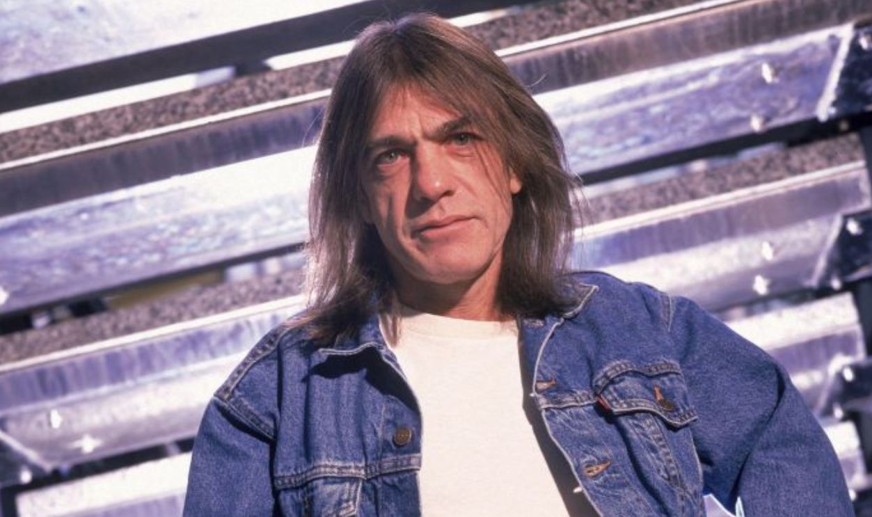 Photo of Malcolm YOUNG and AC/DC; Posed portrait of Malcolm Young, smoking cigarette