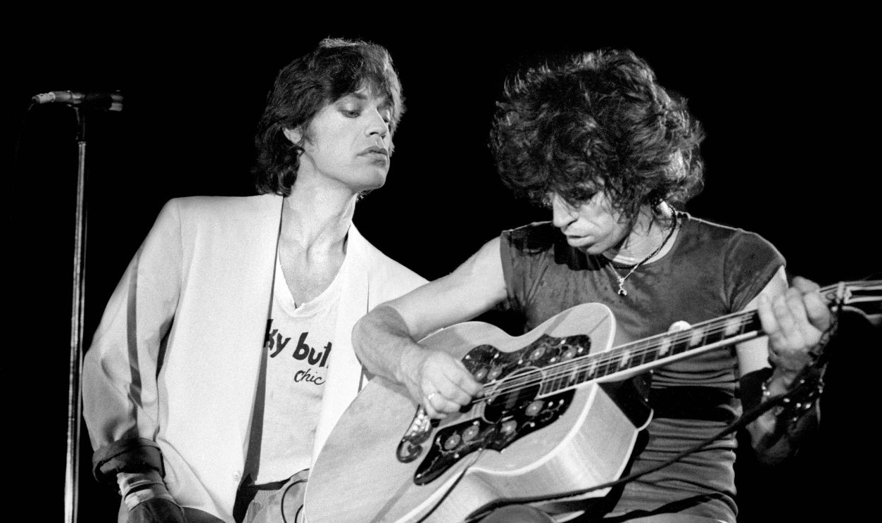 Photo of ROLLING STONES and Mick JAGGER and Keith RICHARDS; Mick Jagger and Keith Richards performing on stage at the Oshawa Civic Auditorium, playing a benefit concert after Keith Richards' drug bust 