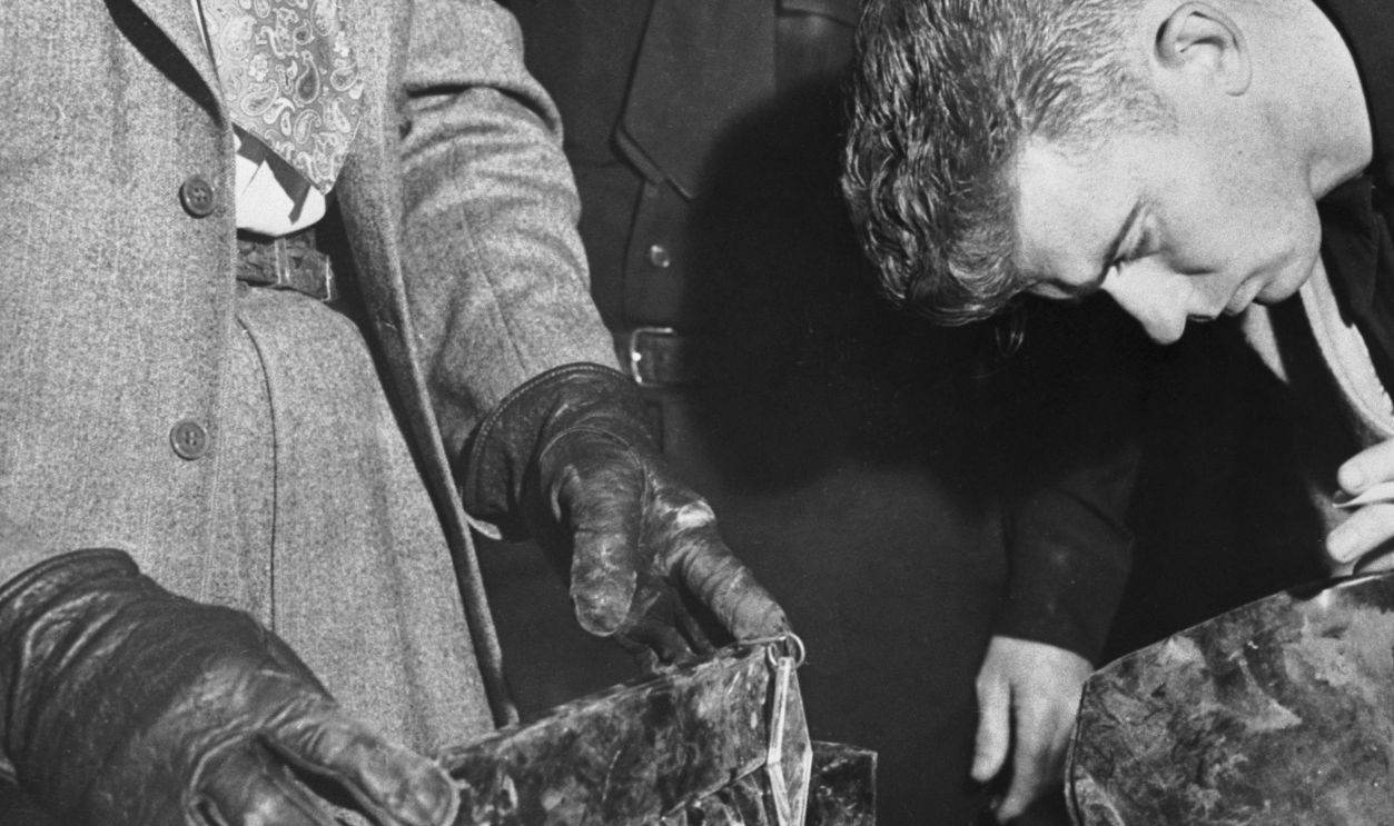 Gettyimages - 514957958, Man Inspecting Purses at Police Station Robert