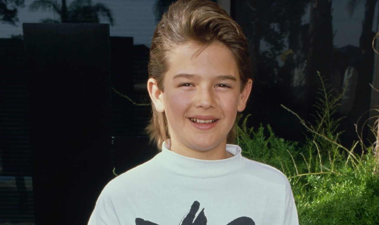 Brandon Call, American Child Actor American child actor Brandon Call, wearing a light grey adidas sweatshirt, with his hands in the pockets of his grey jeans, in Los Angeles, California, circa 1987.