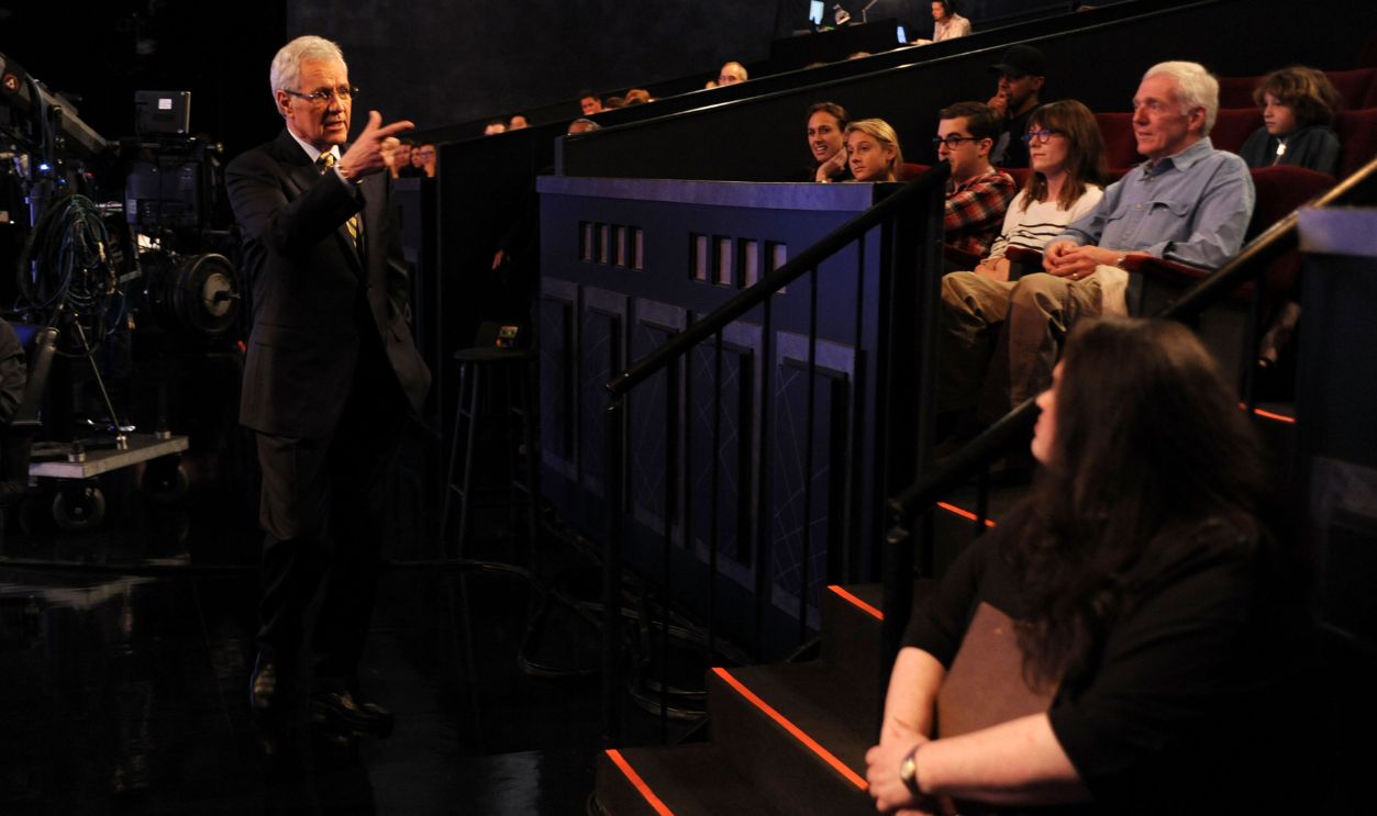 CULVER CITY, CA - APRIL 17: Game show host Alex Trebek (L) interacts with the audience on the set of the 