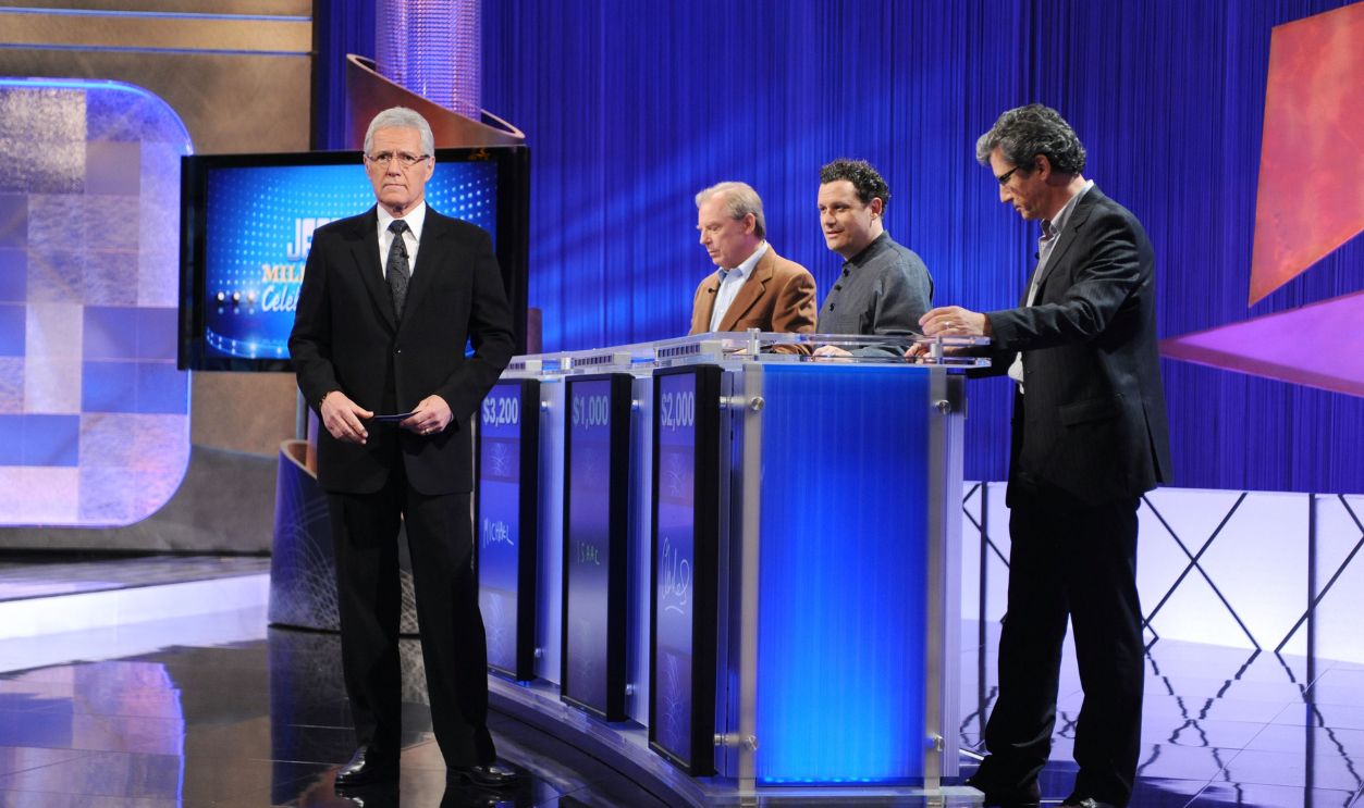 CULVER CITY, CA - APRIL 17: (L-R) Game show host Alex Trebek greets celebrity contestants Michael McKean, Isaac Mizrahi and Charles Shaughnessy on the set of the 