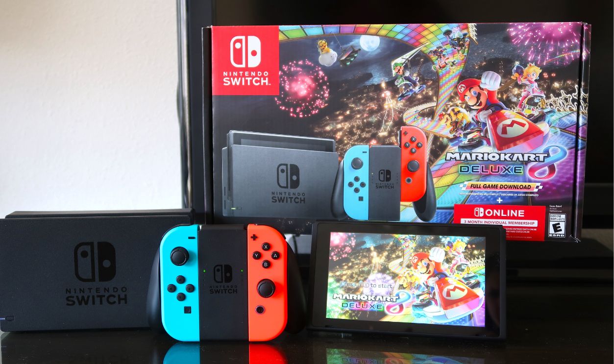Longmont, CO USA - December 18, 2021: Nintendo Switch set with Mario Cart 8 Deluxe. Controllers, joy con controllers, screen, box, charging dock.