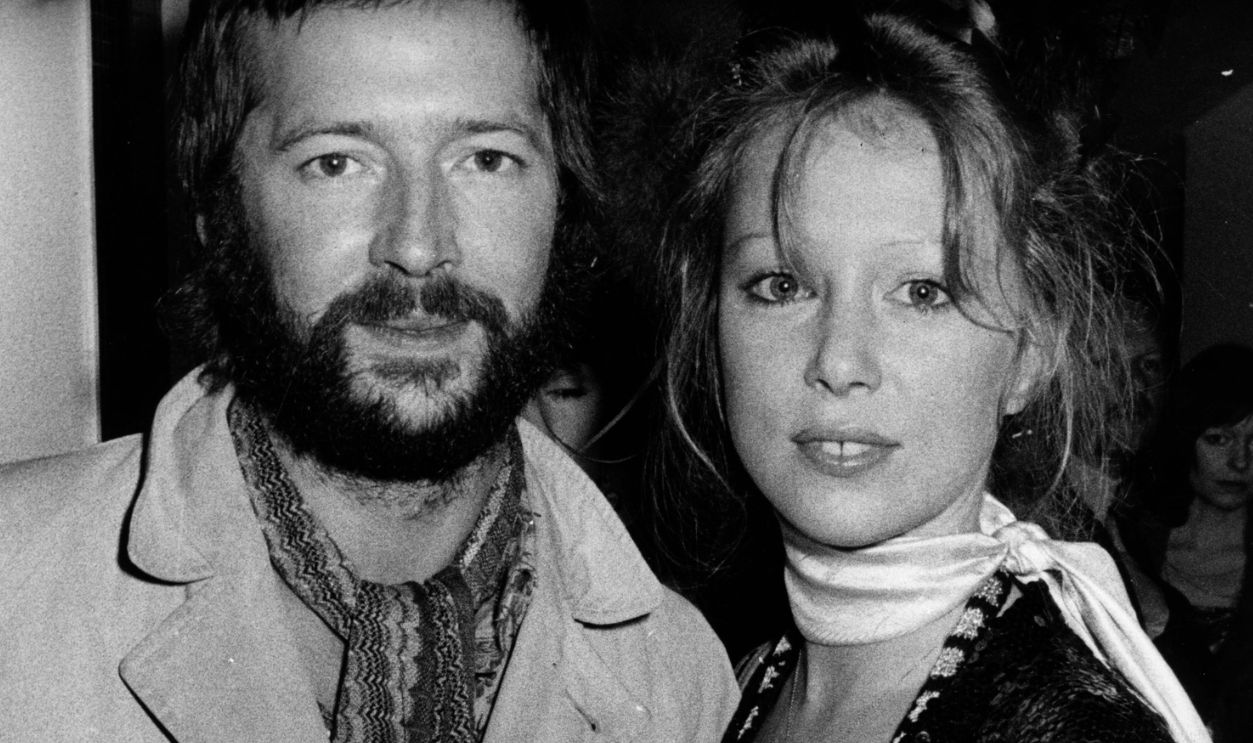 British blues-rock guitarist Eric Clapton and his girlfriend fashion model Patti Boyd, ex-wife of ex-Beatle George Harrison, pictured at the premiere of the rock musical film 'Tommy'