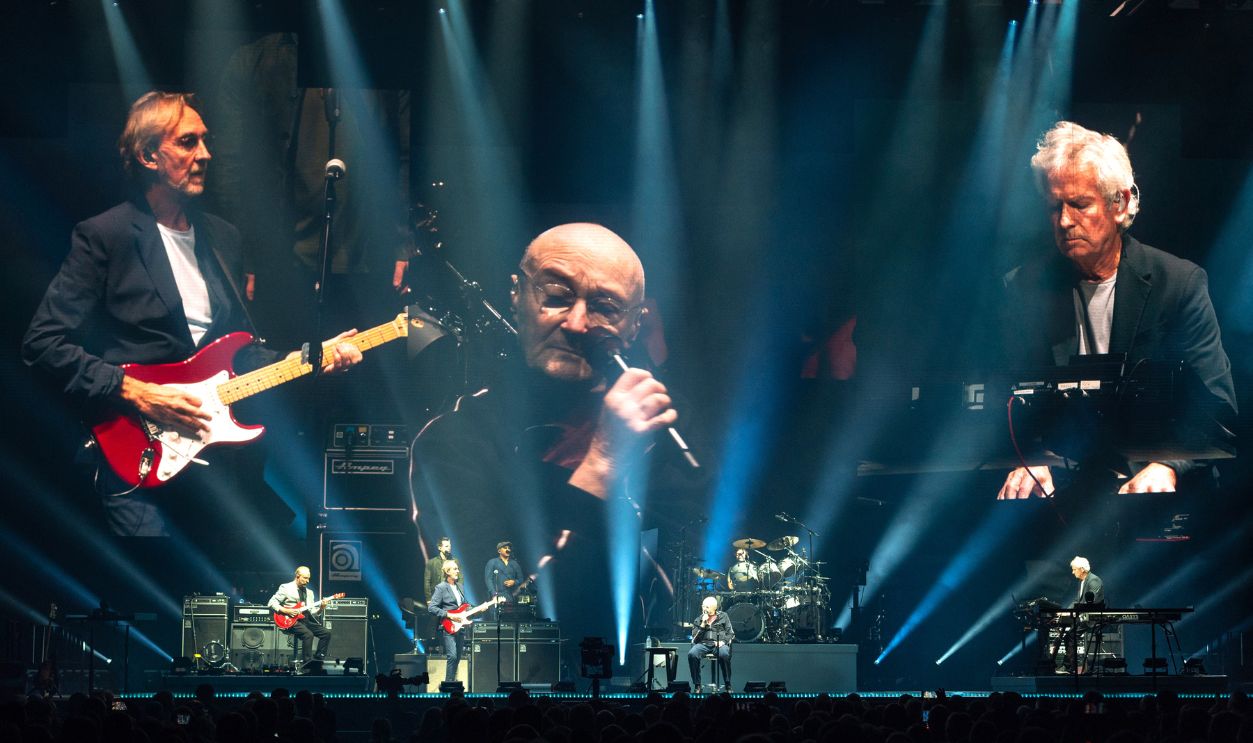 Mike Rutherford, Phil Collins and Tony Banks of Genesis perform on stage 