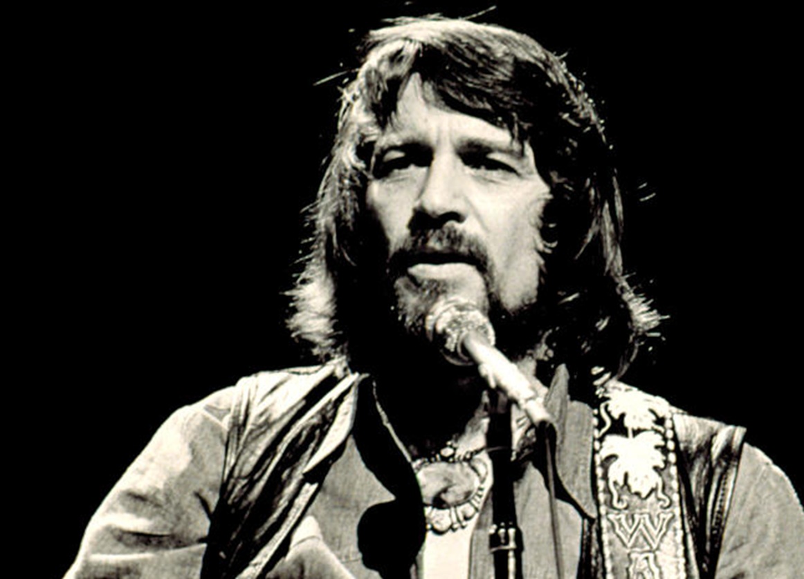 Waylon Jennings performing in concert - 1976