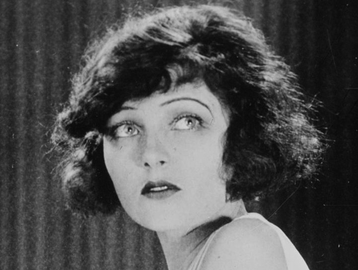 Corinne Griffith wearing a white top