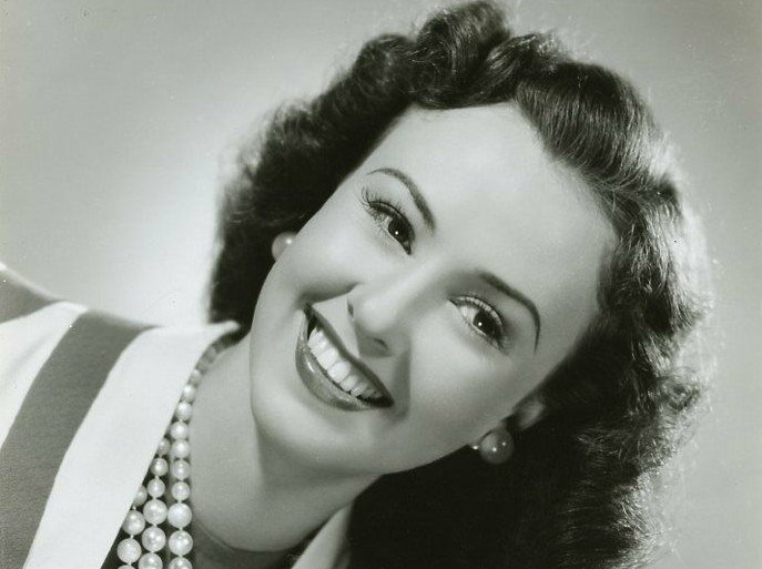 Margaret Lindsay wearing a a pearl necklace