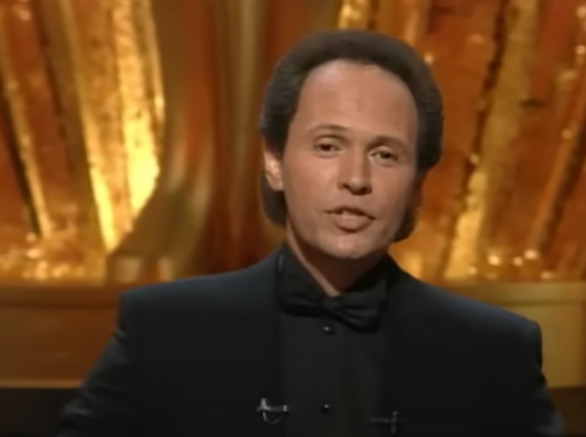 Host Billy Crystal performs onstage during the Annual Academy Awards