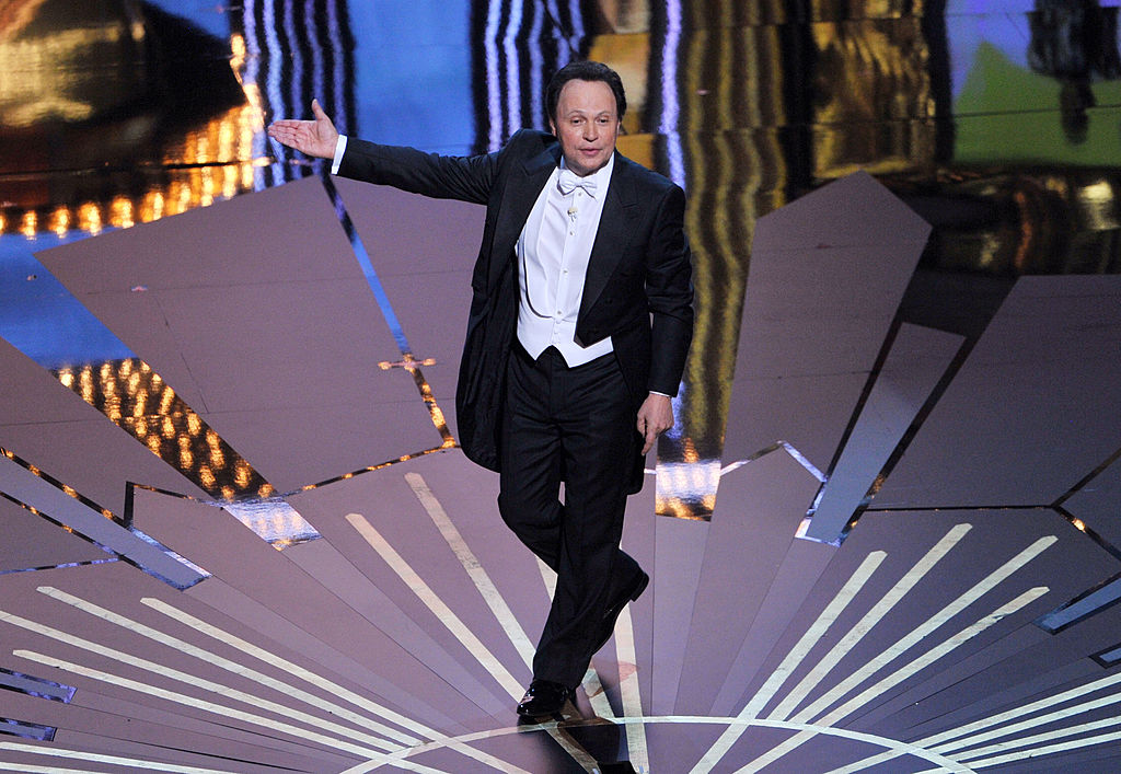 Billy Crystal performs onstage during the 84th Annual Academy Awards