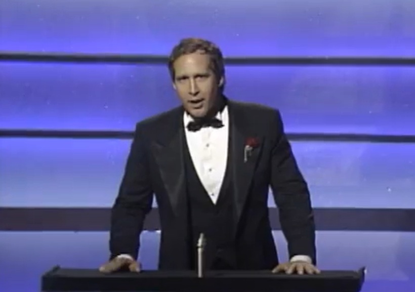 Host Chevy Chase performs onstage during the Annual Academy Awards