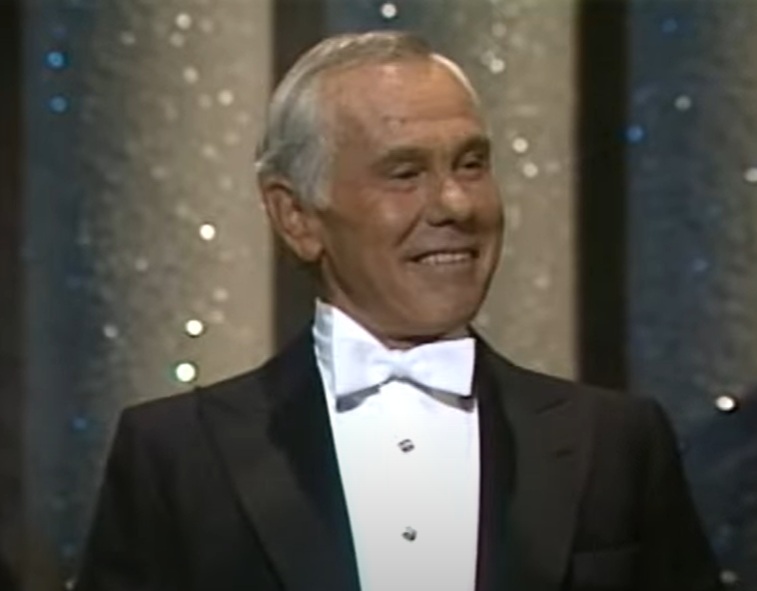 Host Johnny Carson performs onstage during the Annual Academy Awards
