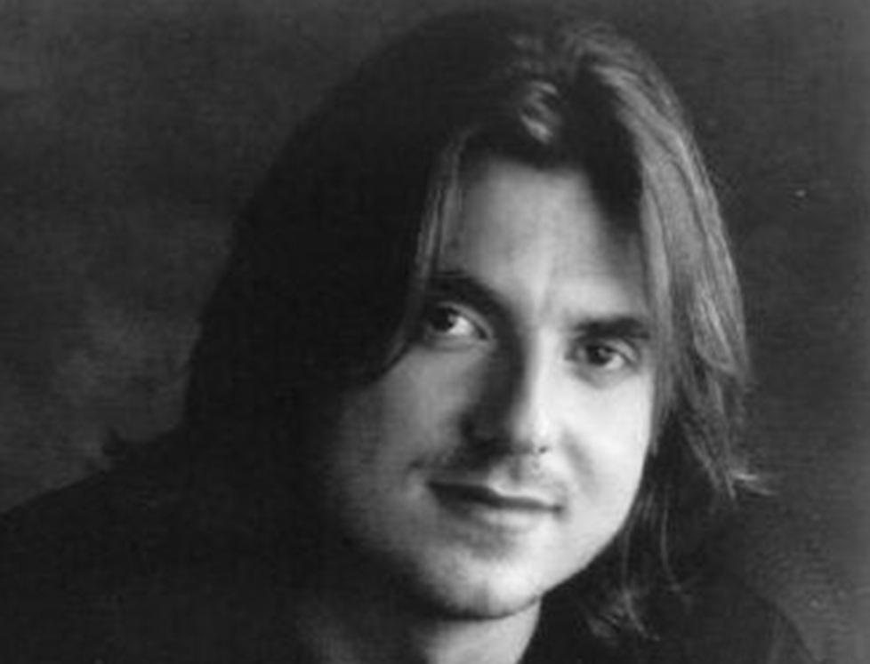 Mitch Hedberg looking at camera.