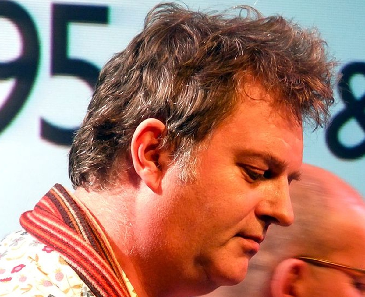 Paul Merton on stage.