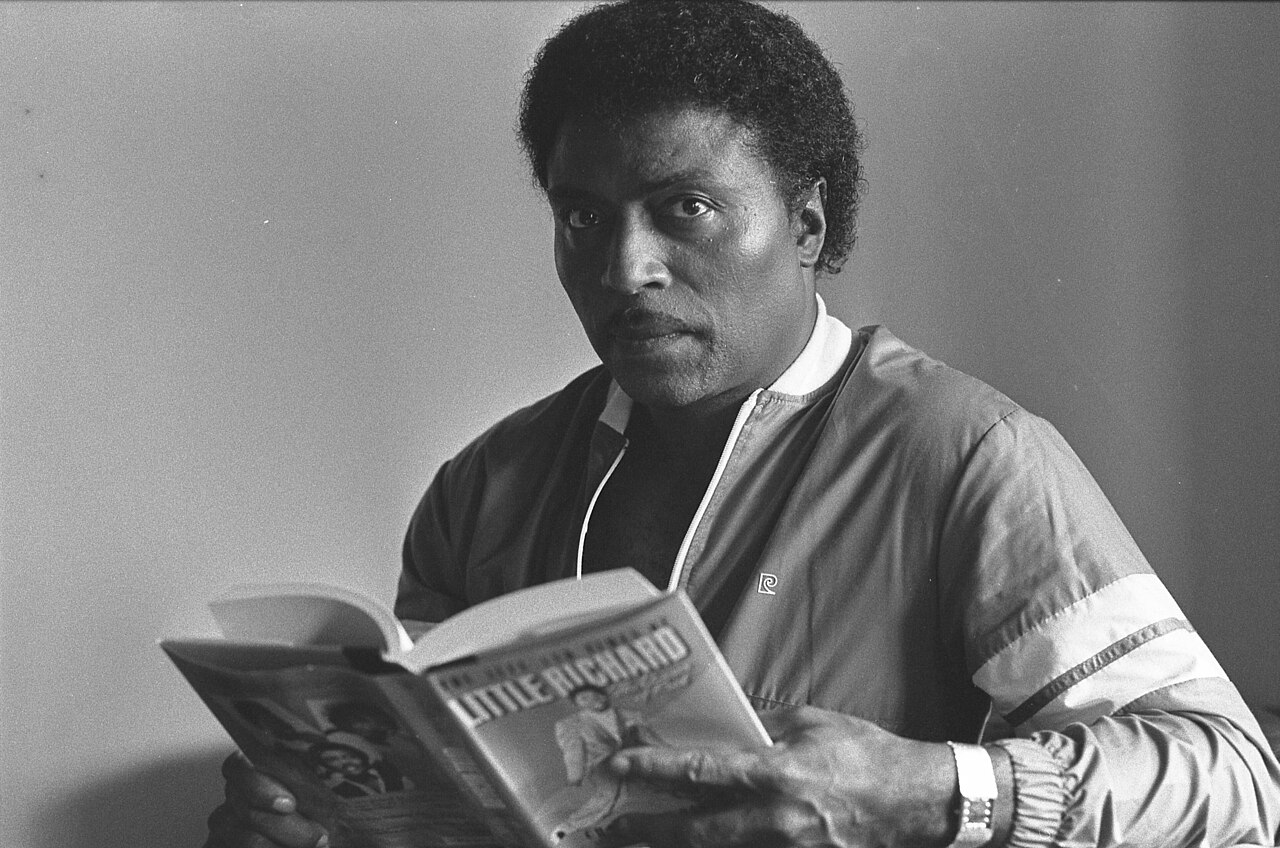 Little Richard reading his biography, 1984