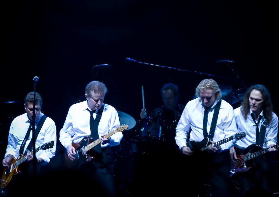 Portrait Photo of The Eagles members performing on stage