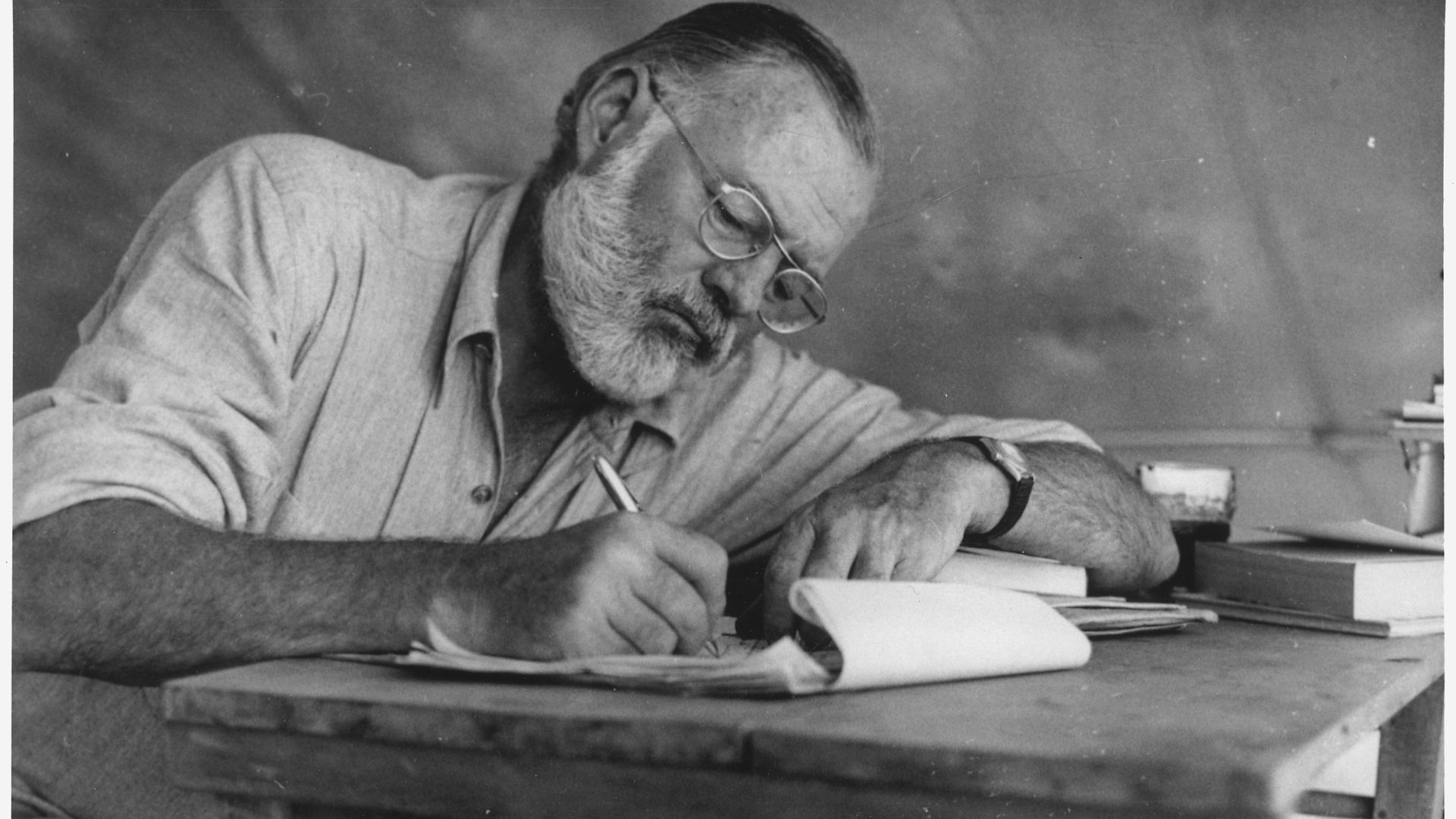 File:Ernest Hemingway Writing at Campsite in Kenya - NARA - 192655.jpg