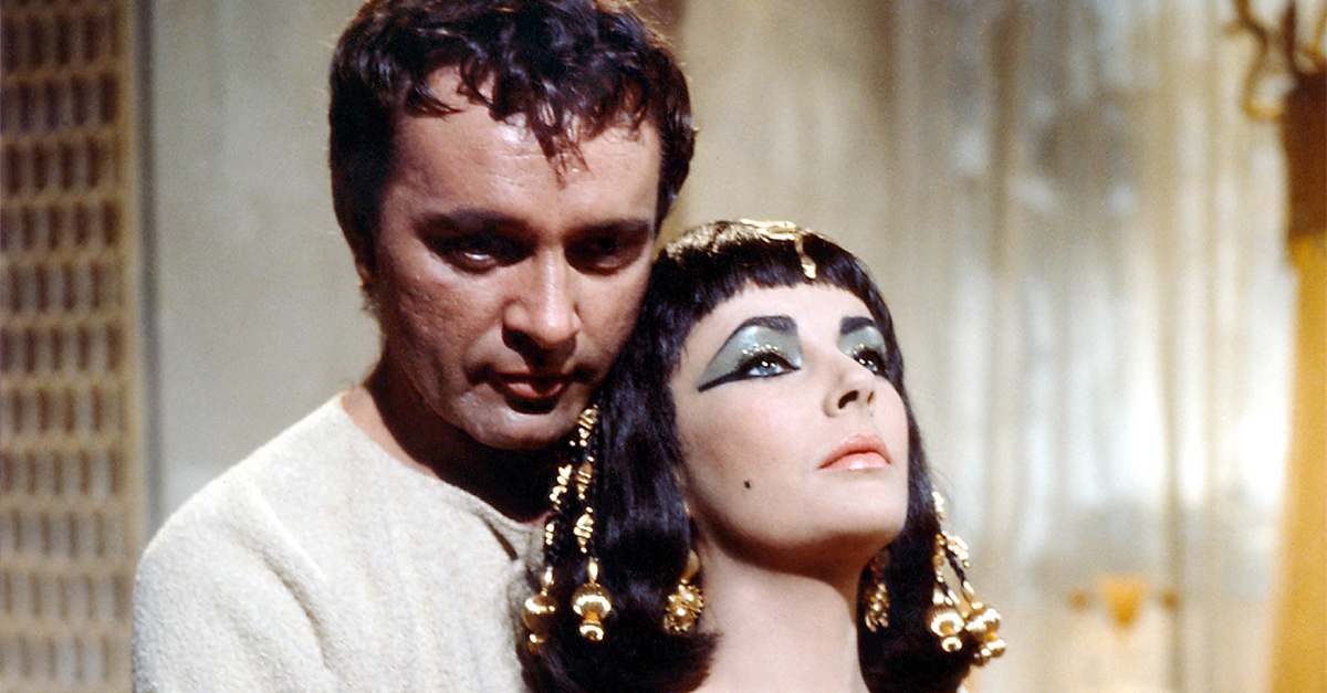 Richard Burton (1925 - 1984), British actor, and Elizabeth Taylor (1932 - 2011), British actress, both in costume in a publicity still issued for the film, 'Cleopatra', 1963. The historical drama, directed by Joseph L Mankiewicz (1909 - 1993), starred Burton as 'Mark Antony', and Taylor as 'Cleopatra'.