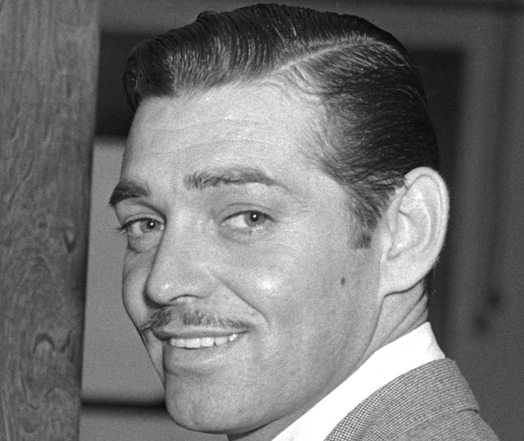 Film actor Clark Gable entering the office of the Assistant U.S. Attorney Jack Powell