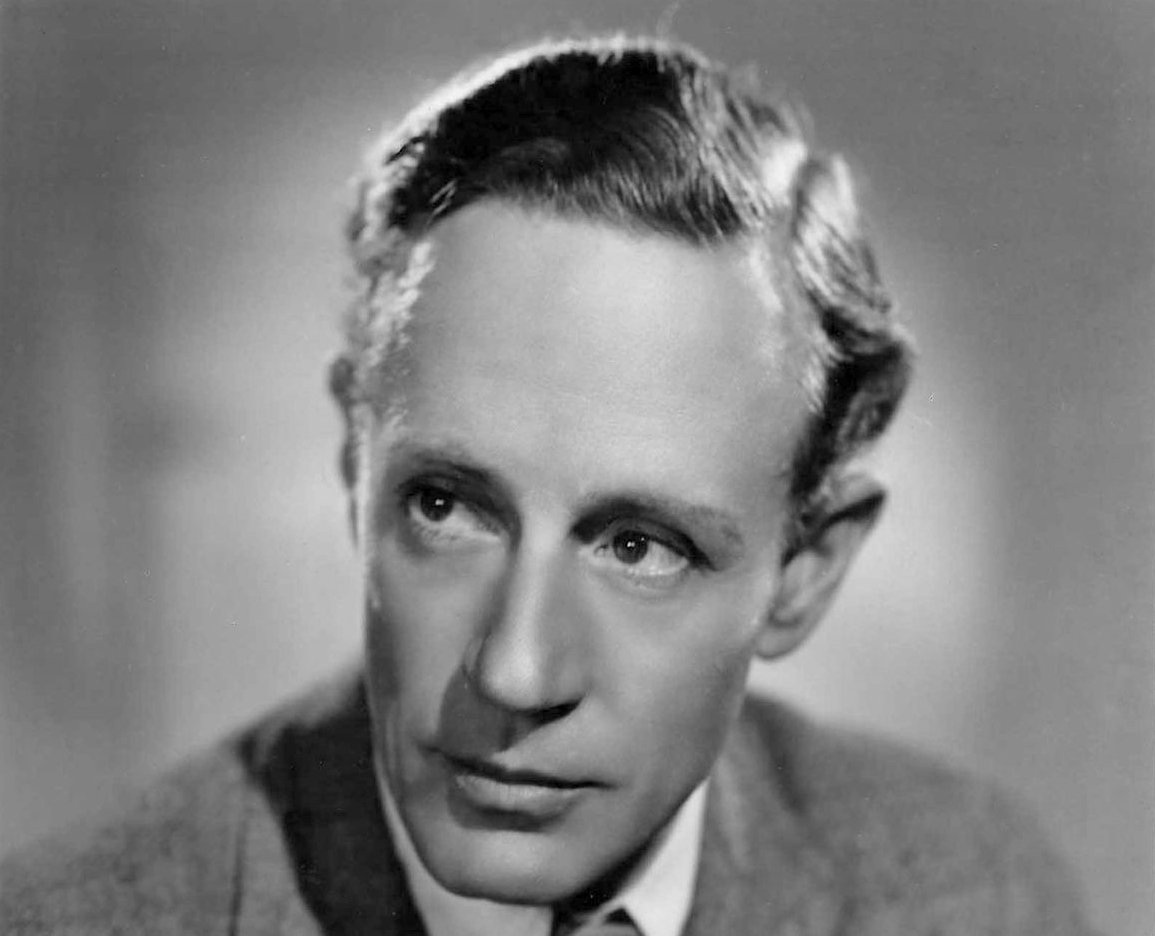 Grayscale Portrait Photo of English actor and director Leslie Howard