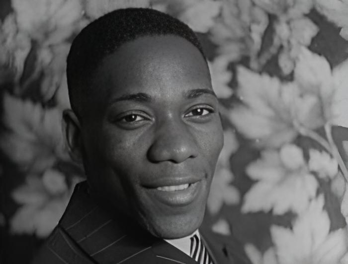 Grayscale Portrait Photo of American actor Oscar Polk smiling