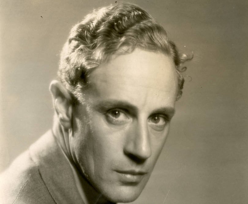 Grayscale Portrait Photo of English actor an director Leslie Howard