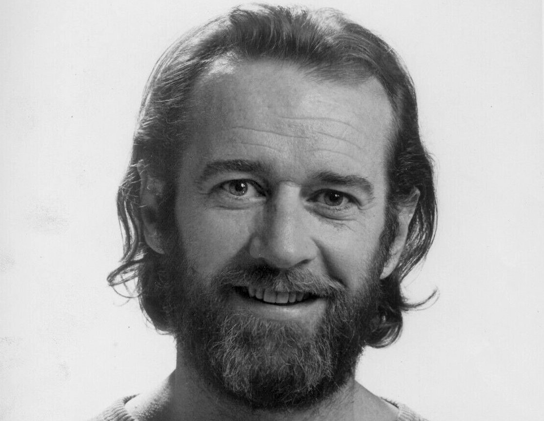 Grayscale Portrait Photo of American stand-up comedian George Carlin 1975