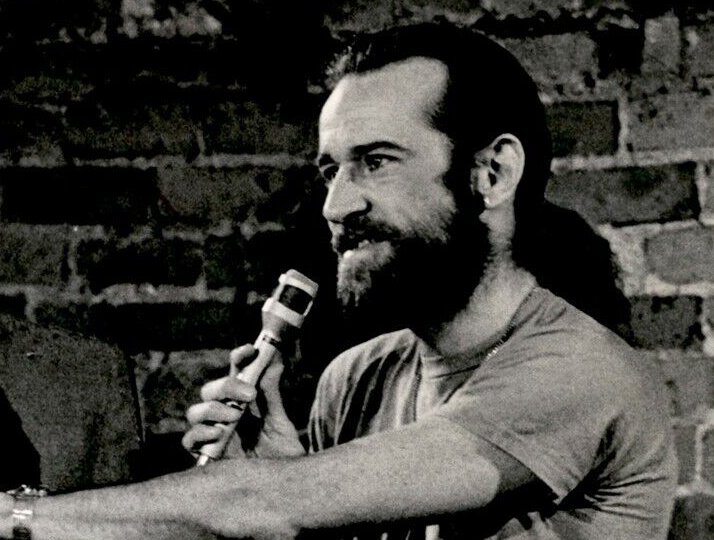 Grayscale Photo of George Carlin and a cardboard cutout of himself