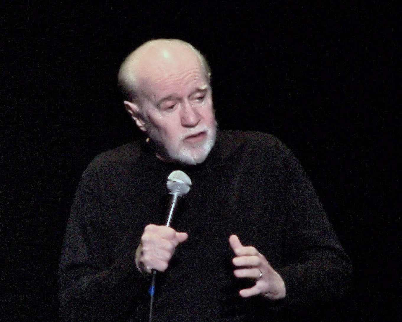 Portrait Photo of George Carlin Performing on stage