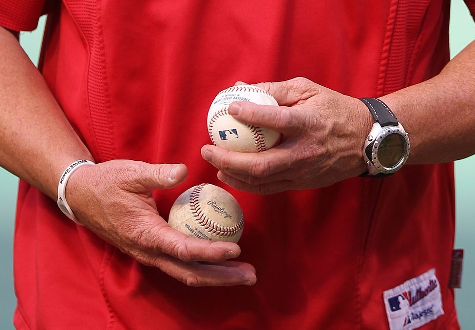 Mark Mcgwire holding baseballs 