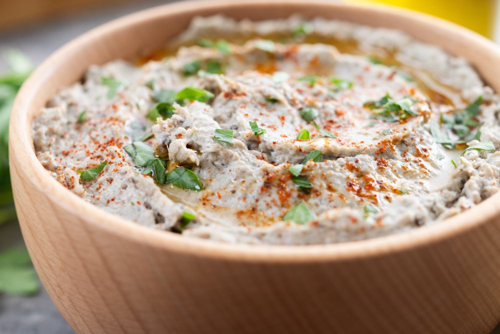 This is a top-down, centered shot of a bowl of Baba Ganoush