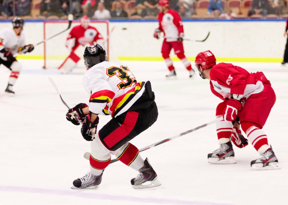 This image captures a dynamic moment in an ice hockey game