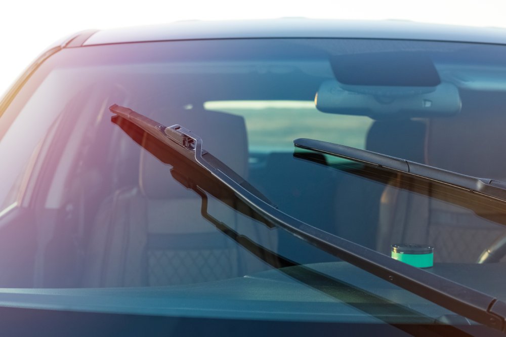 This image features a close-up, slightly angled view of the front windshield