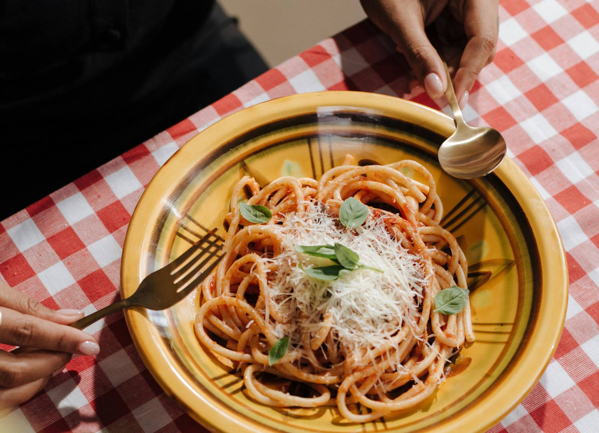 Person eating Plate of Spaghetti