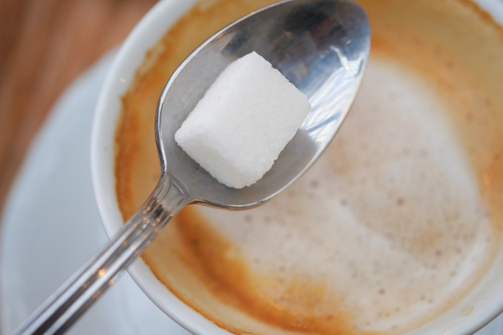 stirring sugar coffee