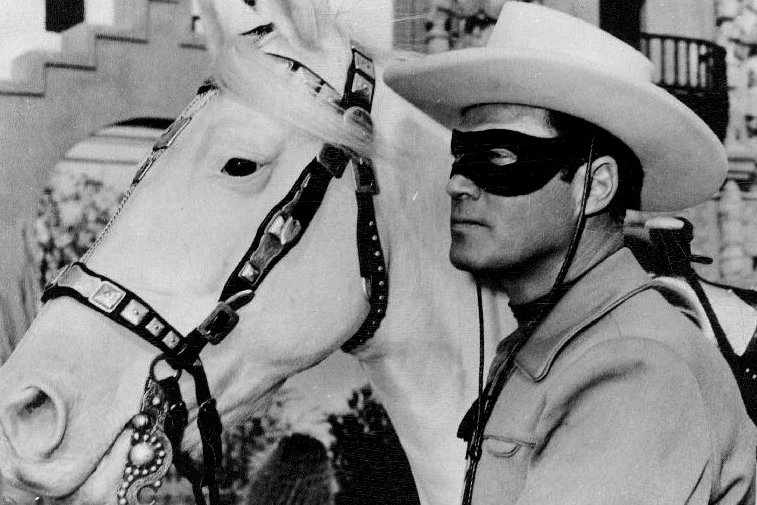 Publicity photo of Clayton Moore as the Lone Ranger and Silver
