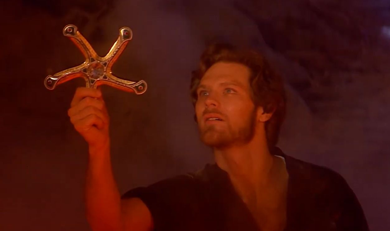 Man holding a shining symbol