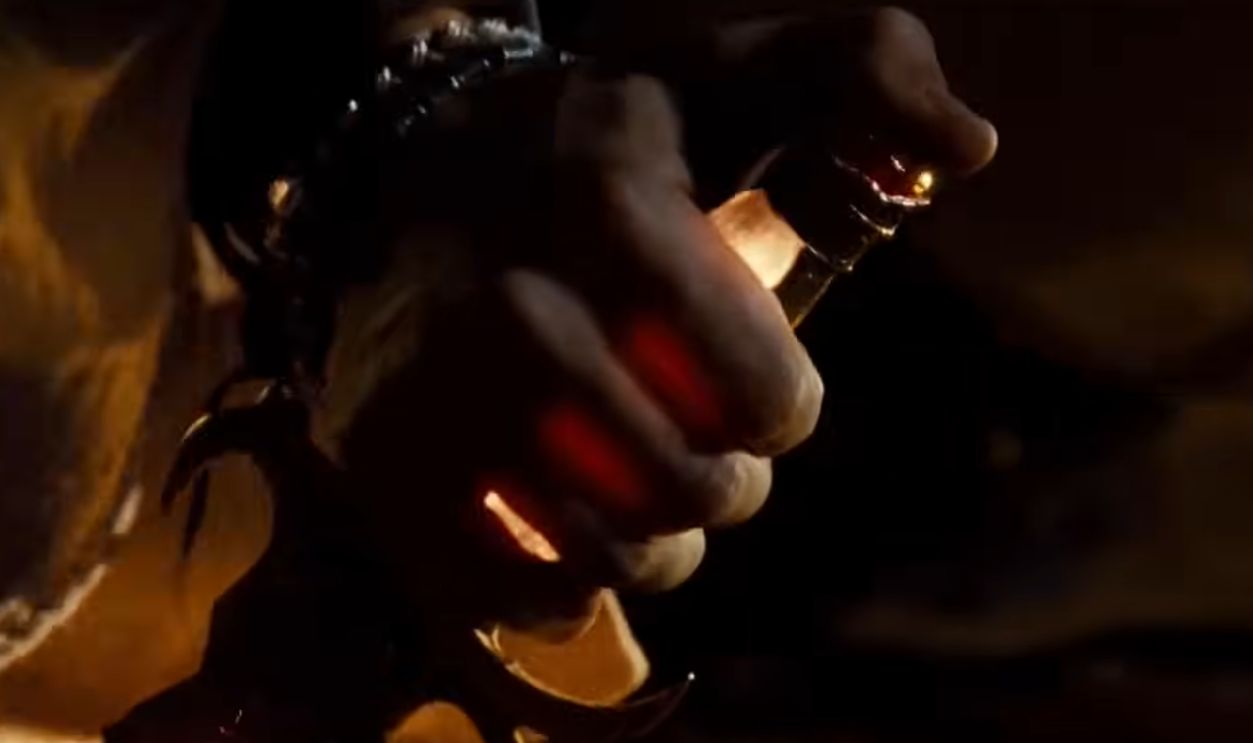 Hand holding a glowing knife