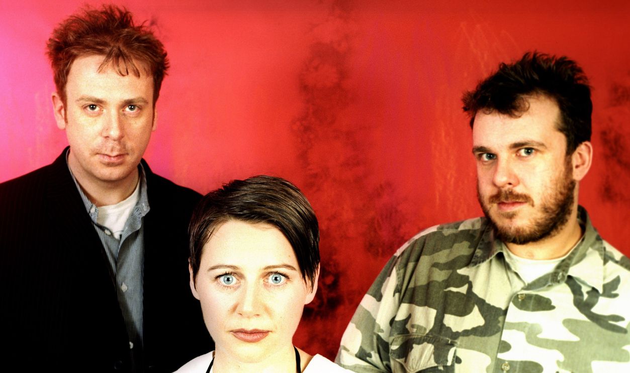 NEW YORK - JUNE 1996: Scottish alternative/ambient music band Cocteau Twins (L - R) bassist Simon Raymonde, lead vocalist Elizabeth Fraser and guitarist Robin Guthrie pose for a June 1996 potrait in New York City, New York.