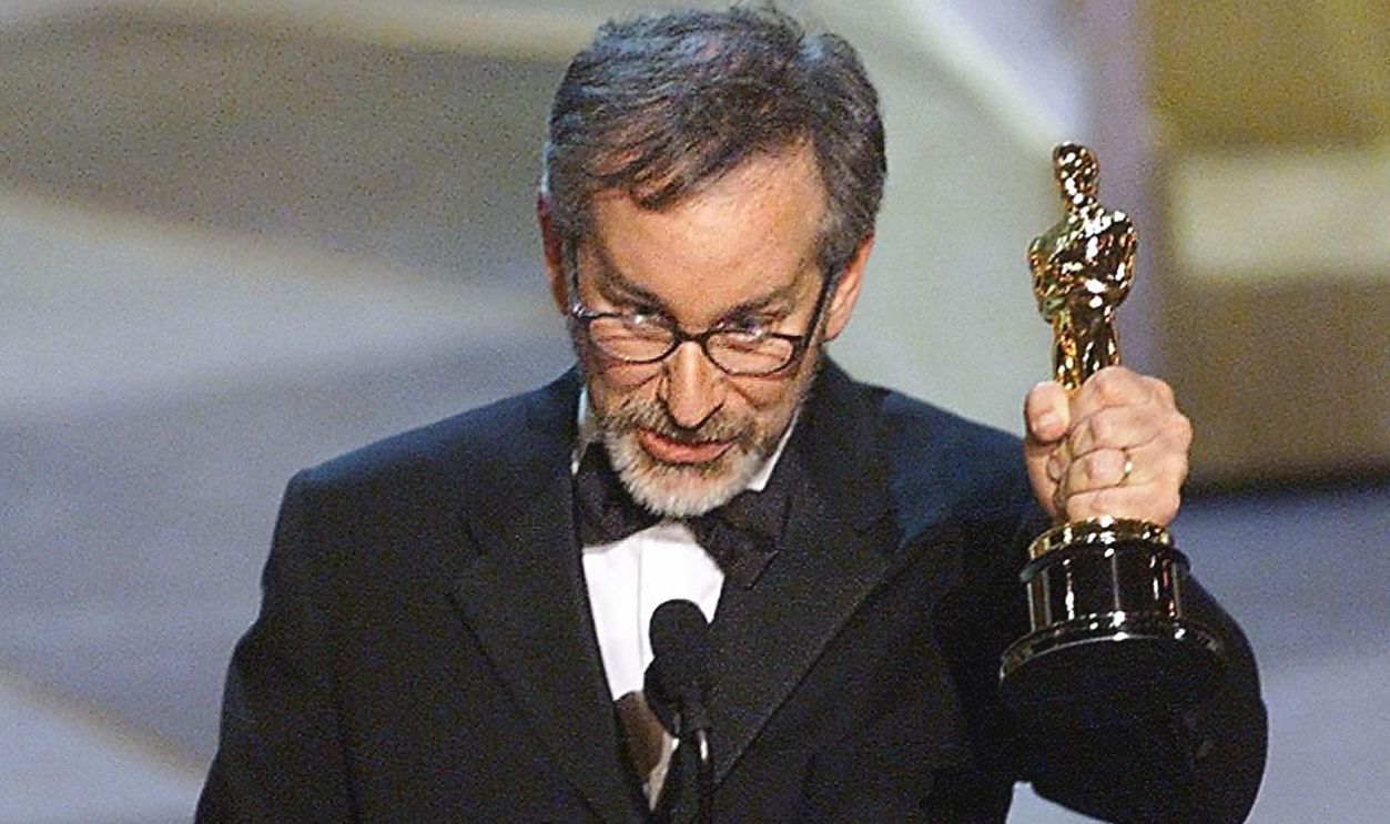 Steven Spielberg holds his Oscar after winning for Best Director for his movie 